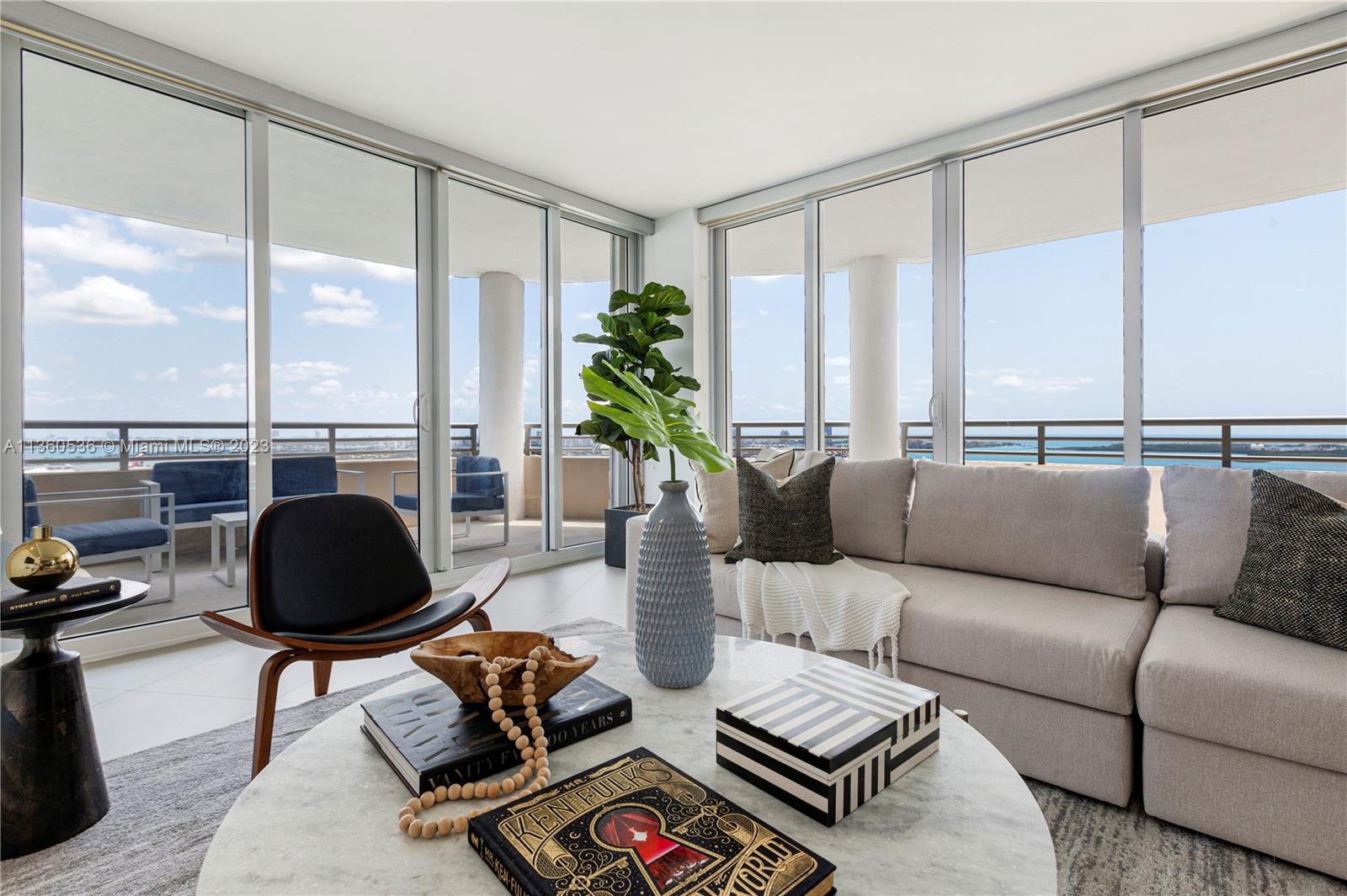 Panoramic views of Biscayne Bay and the Miami skyline await at this large, high-floor, 3-bed + den condo with deep shaded balconies on gated Brickell Key. Move in ready! Interiors have been renovated w/ porcelain flooring, giving the space a luxurious & modern feel. The open kitchen, which overlooks a spacious and inviting living area, has been tastefully updated with state-of-the-art appliances. Tequesta III is a 46-story tower, built in 2001, where you’ll find everything you need to live the quintessential Miami lifestyle, just 1/2 mile from the heart of the financial district. Residents enjoy world-class amenities, including a fully-equipped 2-story fitness center, tennis, basketball, racquetball, pool, BBQ area, and business center, plus 24-hour concierge & security services.
