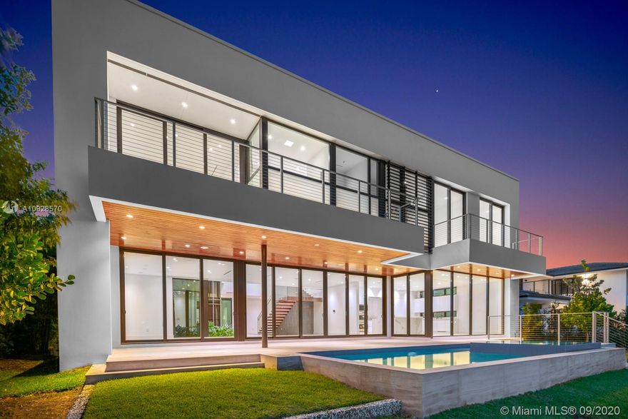 Welcome to this stunning NEW CONSTRUCTION modern gem in the heart of Eastern Shores, an exclusive gated waterfront community in South Florida. This home was built with top of the line millwork and no expenses spared. Over 6,200 SF of living space finished with marble, stone, and wood accents make this a one of a kind design. Features include 7 generous suites, 8 bathrooms, 2 Car garage, staff room, family rooms, Vaccuum elevator, Mia Cucina Italian kitchen, Summer kitchen, and an 80 FT professional equipped dock for yacht enthusiast. Call or Text listing agent Alan Chocron.