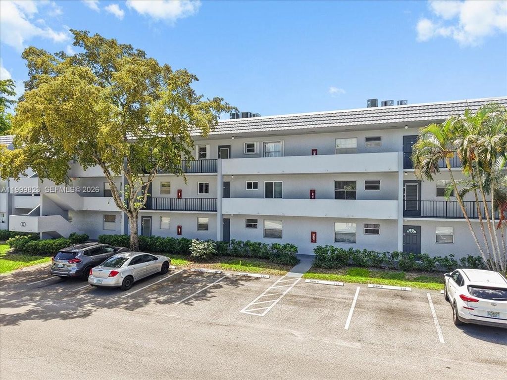 Photo of 8350 Sands Point Blvd #E303, Tamarac, FL 33321 (MLS # A11999823)