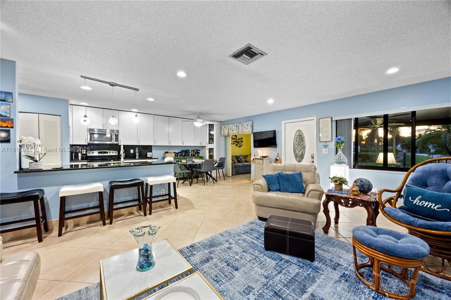 Welcome to “The Sunset House,” a bright corner Villa known for its absolutely beautiful, unobstructed sunset views & incredible coastal vibe. This upgraded 2BR/2BA + den offers an open floor plan, great-sized kitchen w/ white shaker cabinetry and stainless steel appliances. This home has natural light throughout, tile floors (laminate in guest, vinyl in primary), LED recessed lighting & walk-in closets. Enjoy a screened front porch and tiled patio for outdoor living. Recent updates will include a new roof, AC(2024), water heater(2022), impact windows(2014), impact front door (2021) & new washer/dryer. Located in Delray Villas 3, an active 55+ community just minutes from shops, dining, downtown Delray, and the beach. Low HOA at $680 quarterly ($227 monthly). Turnkey and ready to enjoy!