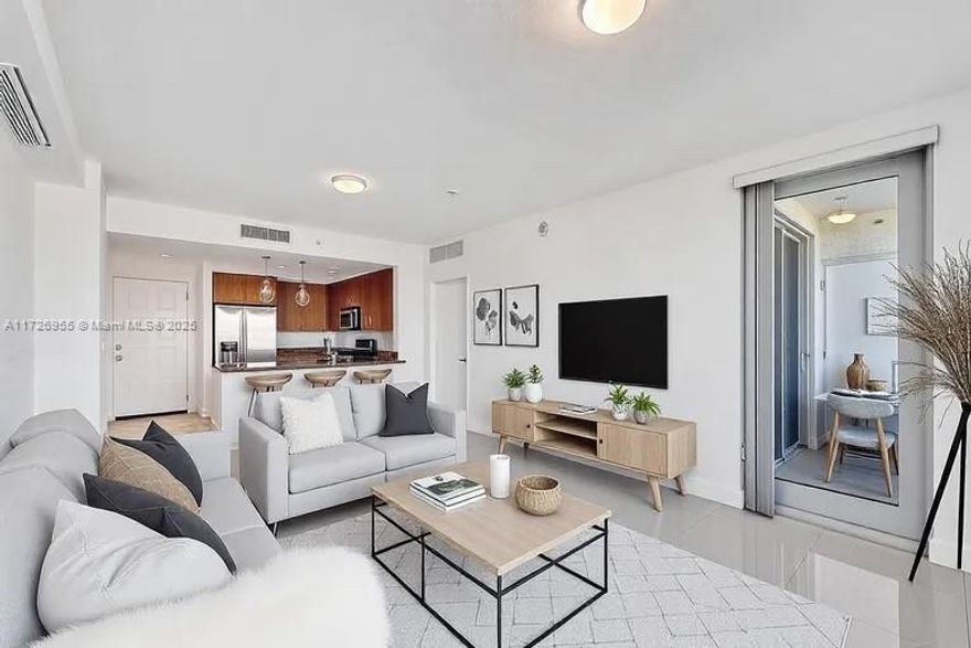 Welcome to Unit 609 at the sought-after Radius condominium! This stunning 2-bedroom, 2-bathroom unit offers modern living with an open floor plan, abundant natural light, and breathtaking views of the city. The sleek kitchen features granite countertops, stainless steel appliances, and a breakfast bar perfect for entertaining. Both bedrooms are generously sized, with the primary suite boasting a walk-in closet and an en-suite bathroom with a soaking tub and separate shower.Enjoy luxury amenities including a rooftop pool, fitness center, theater room, business center, and 24-hour concierge. Ideally located in the heart of Hollywood, you’re just steps away from restaurants, shops, and entertainment, and a short drive to the beach. Seller financing available.