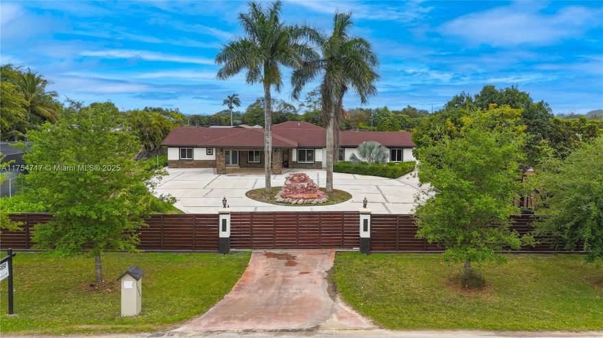 Nestled within agricultural suburbia, your generously-sized circular driveway with custom porte-cochere await your arrival. This homestead is comprised of a 3 bed/2 bath/2 car garage main house, a 1 bed/1 bath casita, outdoor half bath, massive pole barn all atop a 1+ acre lot. Top of the line Samsung appliances brilliantly adorn the kitchen. Wood cabinetry, granite counters in both kitchen and baths; quartz in master. Polished marble floors throughout interior. Outdoor living at its finest with custom-built kitchen, open concept dining and living space; Yellow Pine tongue/groove ceilings with recessed lighting and travertine floors take it to another level. All impact doors/windows; Aqua Kleen water softener/filter system. Wood composite fence; fruit trees; space for RV, boats. No HOA.