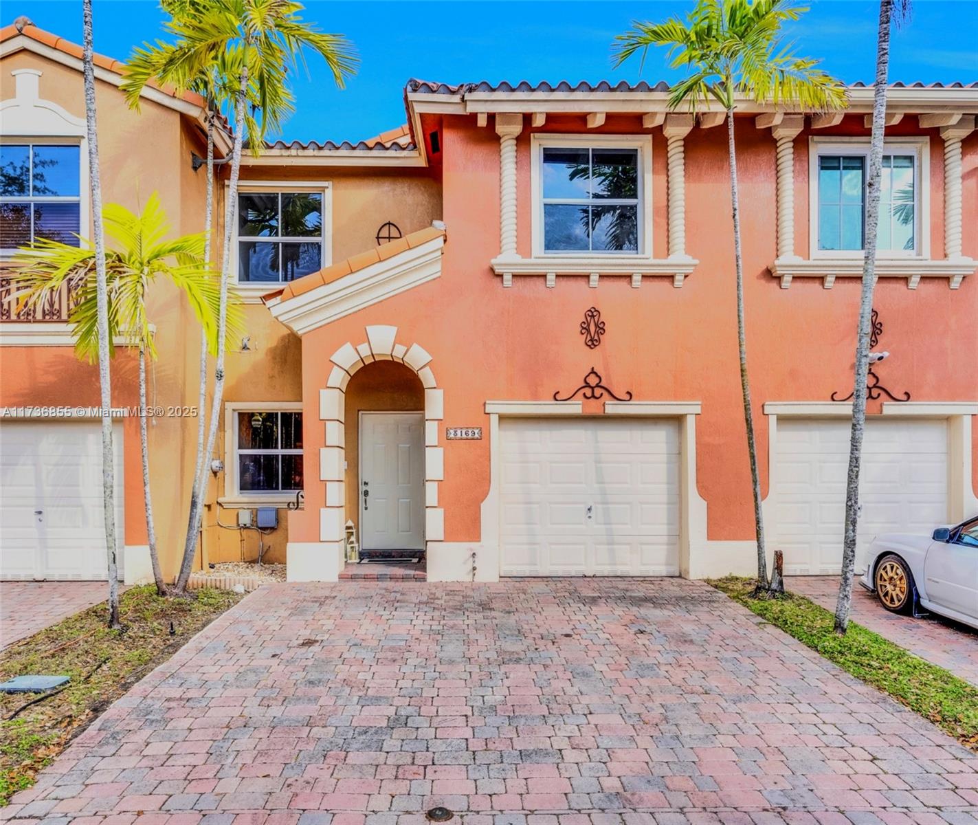 Welcome to this 3-bedroom, 2.5-bathroom townhouse in Venetian Isles, 1-car garage, and 2 car spaces, freshly painted, with new laminated high-traffic waterproof floors on the first floor and all bathrooms, and new carpets on the second floor. Located in a highly desirable private gated community, the open concept offers a bright living room, ideal for both entertaining and relaxing. Comfortable Kitchen, convenient aisle with breakfast area, ample counter space, and plenty of cabinetry. Fenced patio with sliding glass doors. Generous Private Master Suite with walking closets, an en-suite bathroom, a bathtub shower, and a separate shower. The two additional well-sized bedrooms offer great flexibility.
