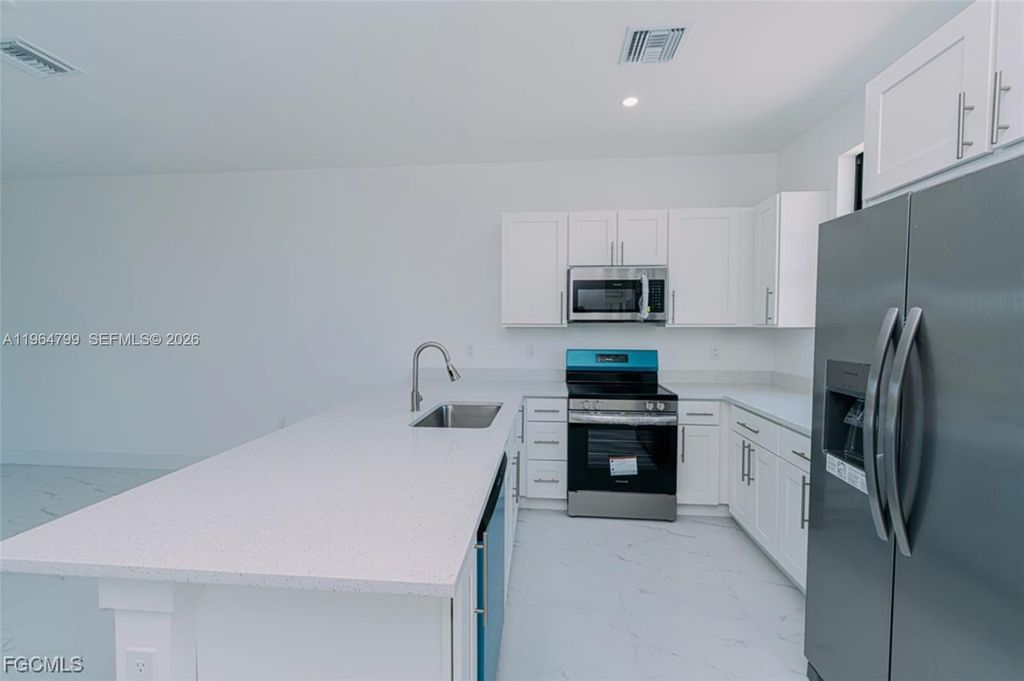 Photo of 478 Lotus Ave S, Lehigh Acres, FL 33974 (MLS # A11964799)