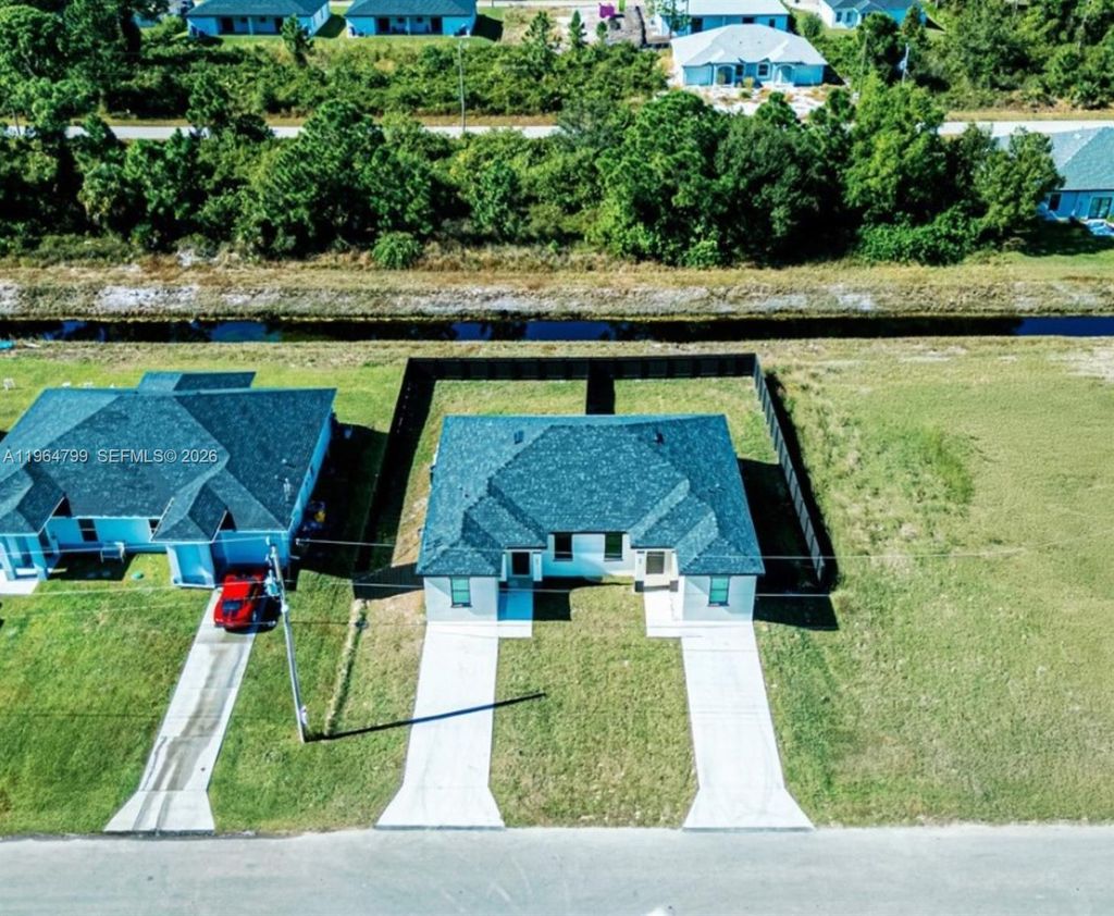 Photo of 478 Lotus Ave S, Lehigh Acres, FL 33974 (MLS # A11964799)