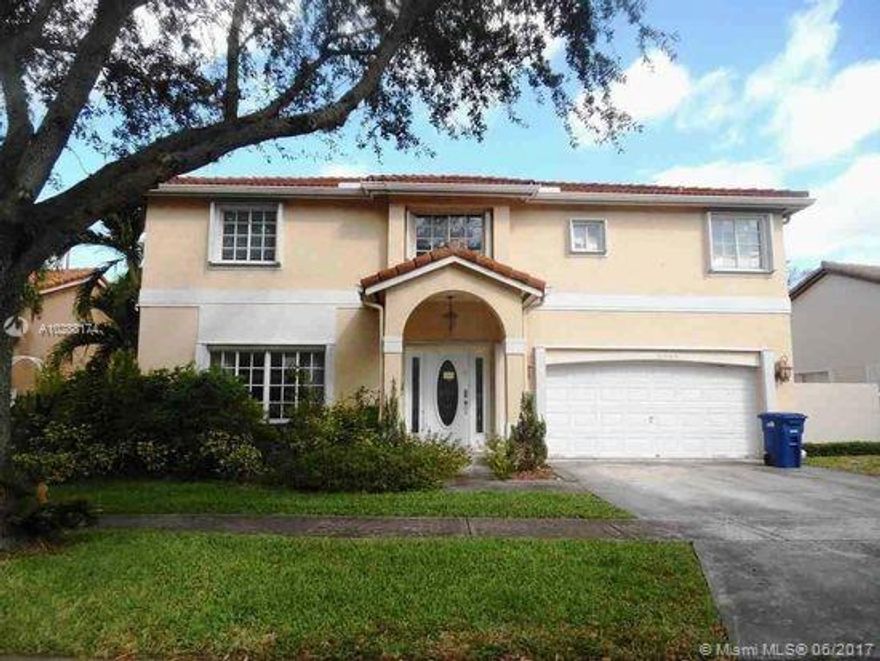 Upgraded Kitchen with new appliances, tile, wood floors, screened patio, larger lot with lake view.