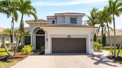 Photo of 12300 NW 77th Mnr, Parkland, FL 33076 (MLS # A12008507)
