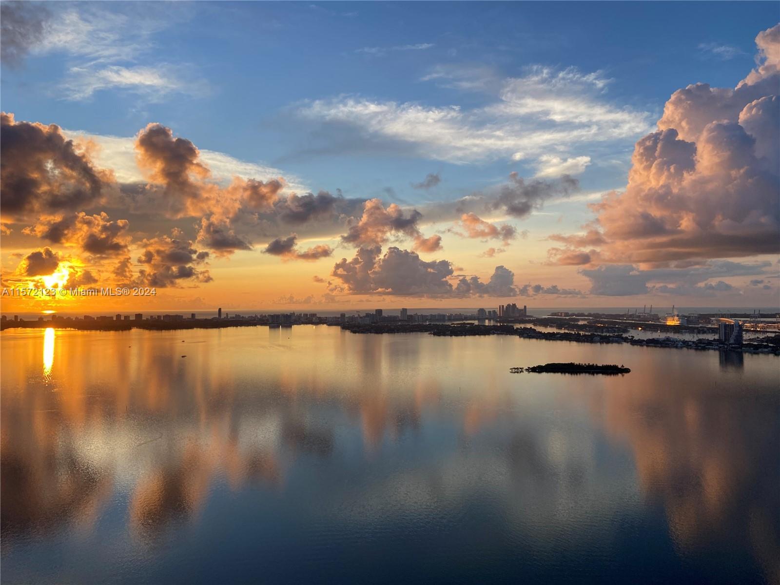 Enjoy Bay and Miami Beach views from this 47th floor unit. 2 bedroom plus den, 3 bathroom, tile floors, bosch and subzero appliances, private elevator that opens to your own foyer. Paraiso Bay offers incredible amenities such as: lagoon type bay view pool, hot tub, spa, gym, screen room, tennis courts, kids pool and play ground, bowling, arcade, club room, business lounge, cigar room, wine room, daily fitness classes and events for residents. 1 assigned parking included.