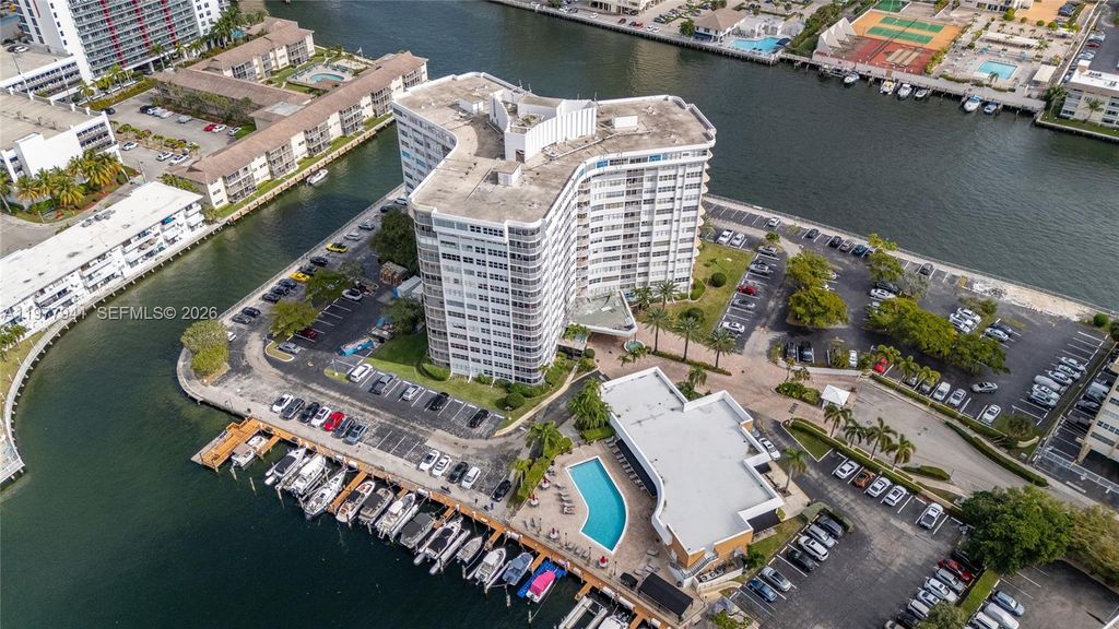 Photo of 100 Golden Isles Dr #104, Hallandale Beach, FL 33009 (MLS # A11977941)