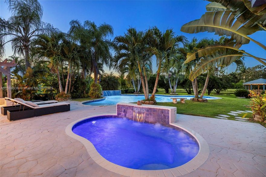 Discover refined living on a full acre in Kapok Village Estates, one of Davie’s most coveted communities. This 3,560 sq. ft. estate offers 4 bedrooms, 3 full baths, plus a versatile office/den. Designed for both elegance and comfort, the home features soaring ceilings, expansive living spaces, and a 3-car garage. Perfect for entertaining, it boasts a pool, heated spa, summer kitchen, and tranquil lake views. Surrounded by Davie’s equestrian charm and minutes from Long Key Nature Center, top schools, and major highways, the location offers both privacy and convenience. Seller is motivated and open to assisting with buyer needs, making this opportunity even more compelling.