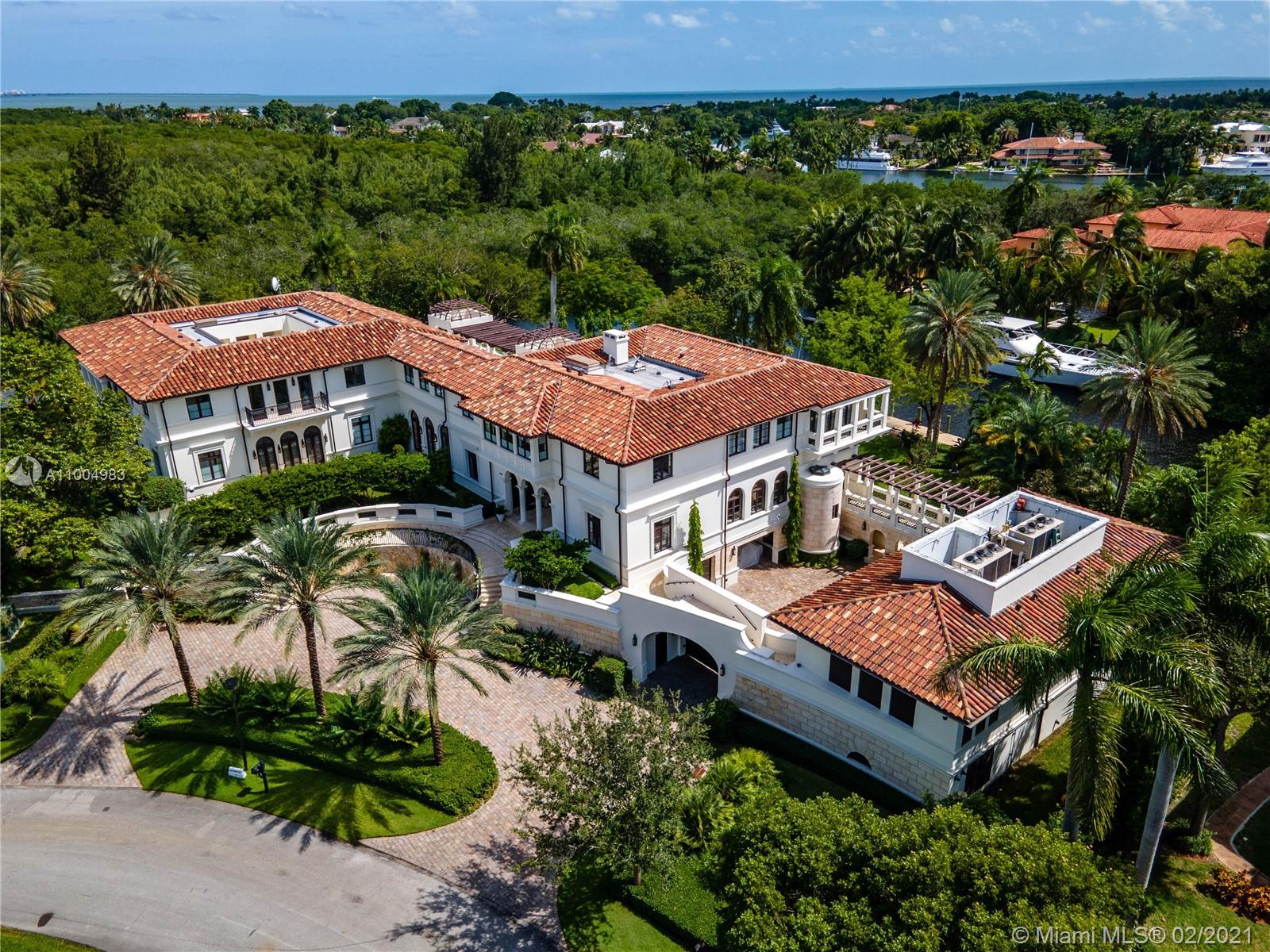 One of a kind opportunity lo live in this impressive modern Mediterranean estate! Villa Costanera is located in exclusive Islands of Cocoplum, this masterpiece was designed by Rafael Portoundo and sits on a corner lot with 1.3 acres for maximum privacy and over 480ft of water frontage. Offering 20,546 sf of living space, this home features exceptional craftsmanship with designer interior finishes, commercial elevator, 3 kitchens, separate staff/guest quarters, expansive terraces + more. Situated on Coral Gables waterway with direct access to Biscayne bay.