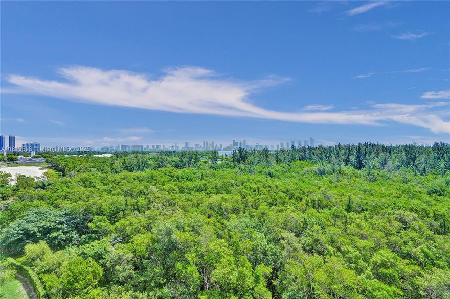 Enjoy tranquil, panoramic views overlooking the Oleta River State Park Reserve from this beautifully upgraded 2 bedroom + den, 2 bath residence. This corner unit features a formal foyer, sleek marble floors, open living and dining spaces, a modern kitchen with granite countertops and stainless-steel appliances, and floor-to-ceiling impact windows that flood the space with natural light. The oversized primary suite offers two built-in walk-in closets and a luxurious en-suite with dual vanities, spa tub, and separate shower. A spacious den adds versatility, ideal for a home office or guest area.