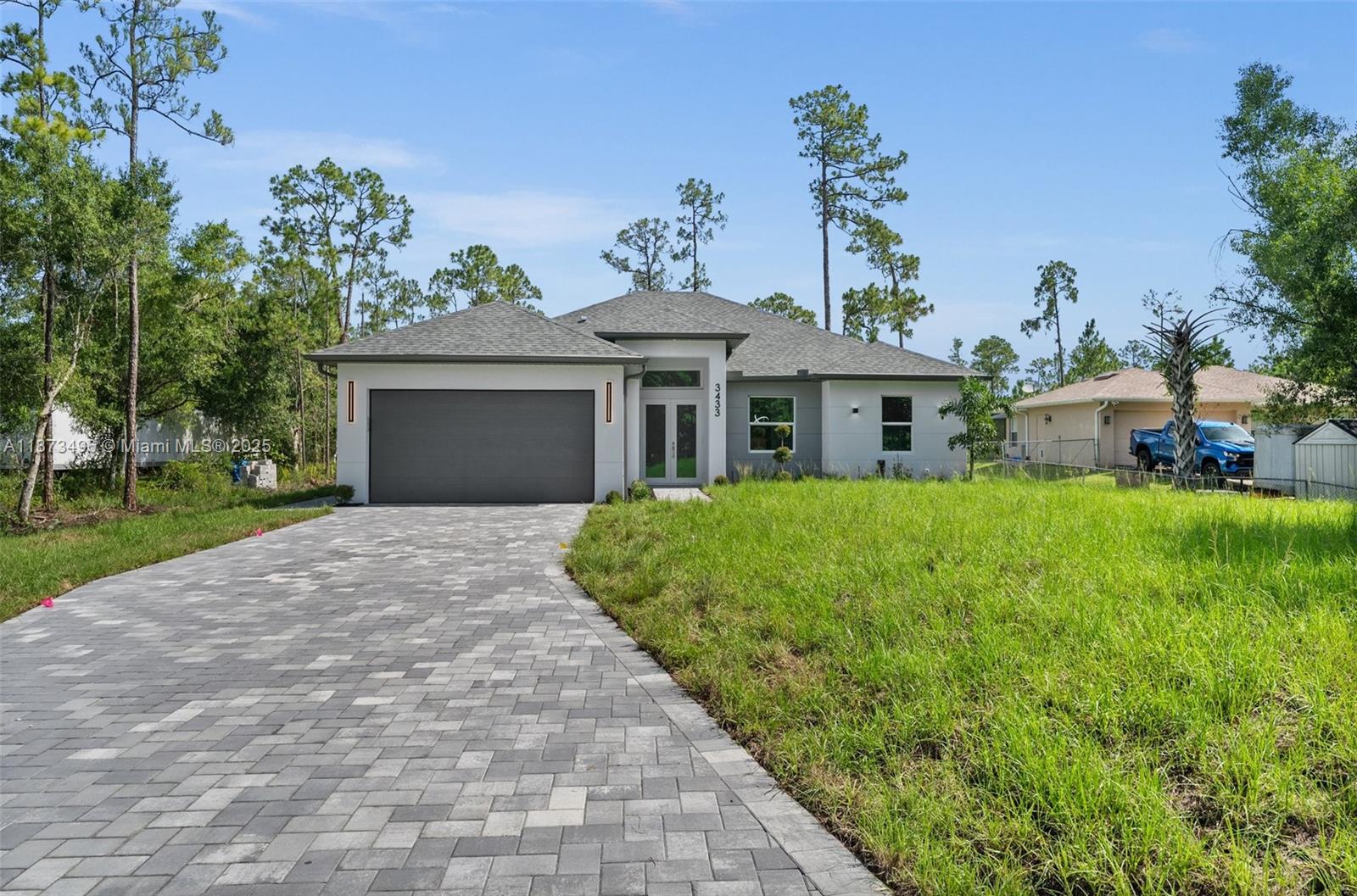 BRAND-NEW HOME on a 1.14-acre 100% upland lot, with 1,774 sq. ft. A/C living area and 2,950 sq. ft. under roof. Constructed residence 2025.It features 4 bedrooms and 3 full bathrooms,the kitchen with quartz countertops,waterfall island,soft-close cabinets,and high-end stainless steel appliances. There are custom built-in closets in every bedroom. The two-car garage boasts an epoxy finish.Includes a reverse osmosis water purification system.The kitchen,bathrooms,exterior paver floors,and spacious backyard highlight.You can building a pool or guest house; there is no HOA and no restrictions for pets.If you seek quality of life surrounded by nature,close to the beach,in a peaceful.Just minutes from the City of Ave Maria and Naples, restaurants, top schools, and beaches.HOME WARRANTY INCLUDED!
