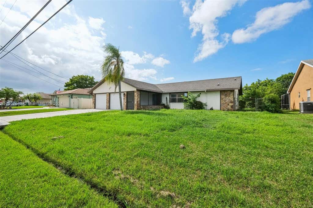 Photo of 257 SW Whitmore Dr, Port Saint Lucie, FL 34984 (MLS # A11617682)