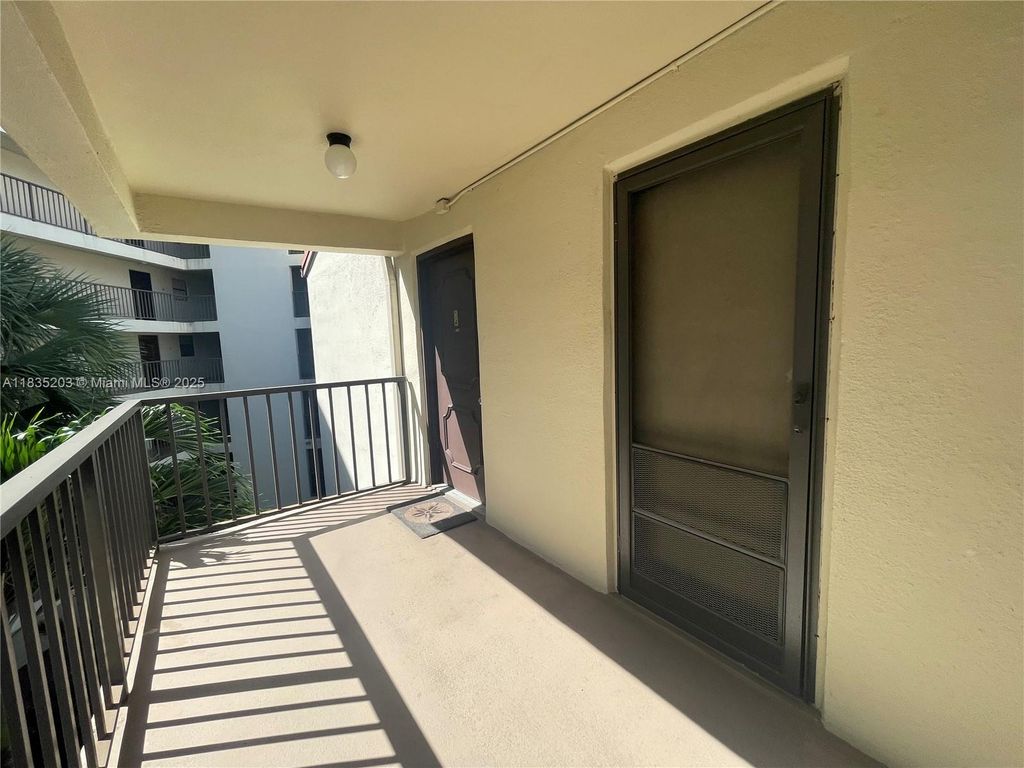 Photo of 2312 S Cypress Bend Dr #410, Pompano Beach, FL 33069 (MLS # A11835203)