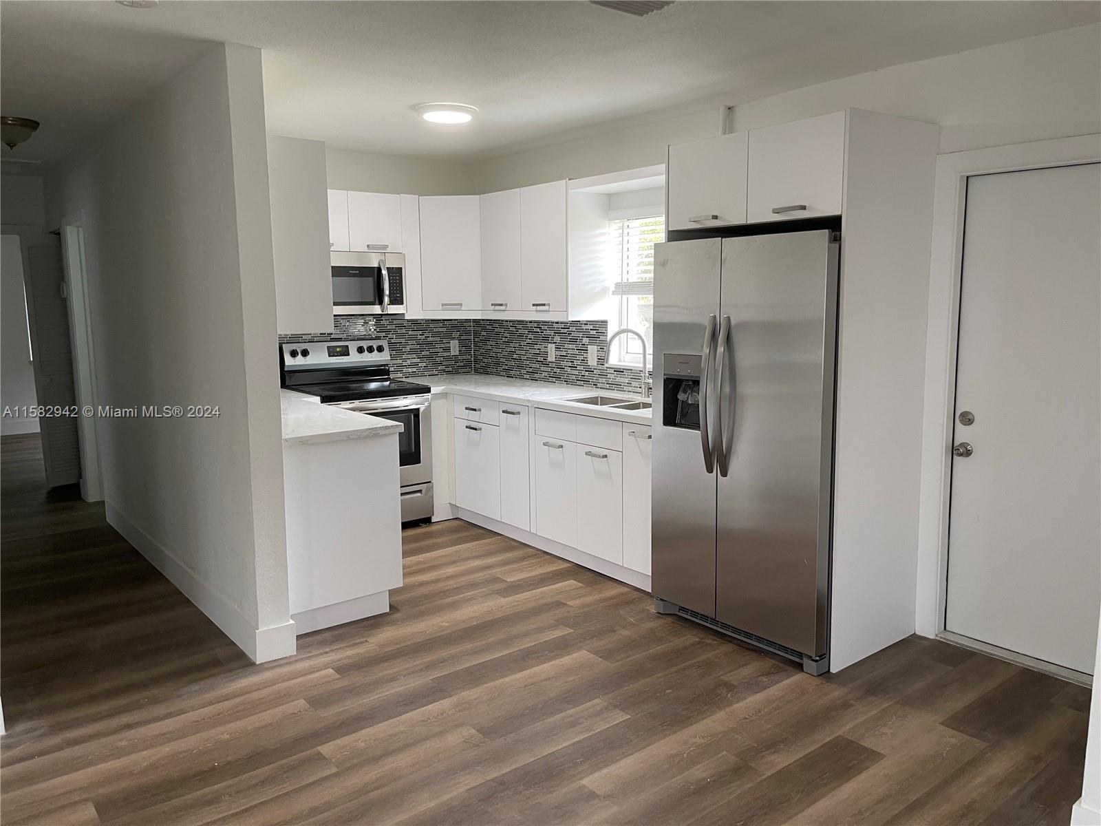 3/1 NICE HOUSE  * GOURMET KITCHEN WITH  APPLIANCES STAINLESS STEEL , IMPACT WINDOWS & BLINDS**TiTAN WATER HEATER" AND WASHER DRYER . IF YOU ARE LOOKING FOR A HOME WITH BIG BACKYARD  FENCED, THIS HOUSE WON'T LAST !!!! . 5 MINS AWAY FROM COSTCO , TARGET PUBLIX NEARBY . SEE BROKER REMARKS