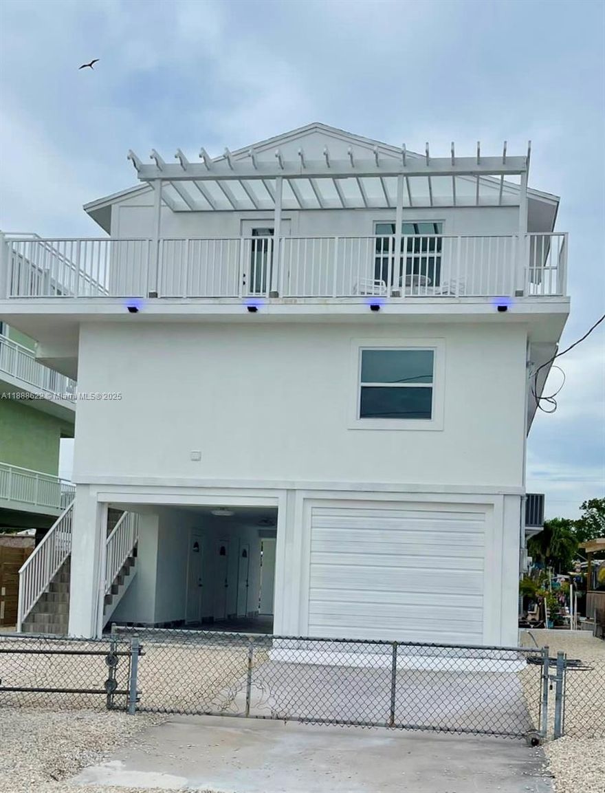 This stunning Key Largo waterfront residence has been fully renovated and is now available for sale. Featuring four spacious bedrooms and four bathrooms, the home offers the ideal layout for family living or a vacation retreat. Enjoy direct water access for boating and water sports, along with breathtaking panoramic views from terraces on both the second and third floors. A rare opportunity to own a true waterfront paradise in the Florida Keys!