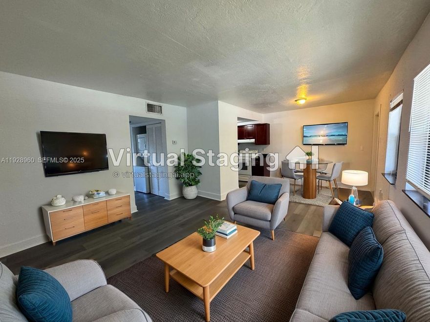 Beautifully updated 2/1 featuring contemporary flooring, central AC, and a bright open-concept layout. Enjoy an upgraded bathroom, plus a private balcony off the primary bedroom—perfect for morning coffee or evening relaxation. In-unit washer and dryer add unbeatable convenience.

Ideal location just off Biscayne Blvd and 135th St, close to shopping, dining, and everything you need. Move in with just first and security! Rapid approval!