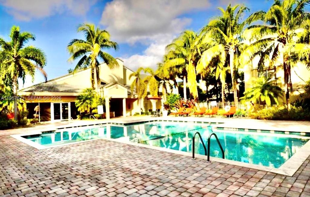 Photo of 5654 Rock Island Rd #214, Tamarac, FL 33319 (MLS # A11957671)