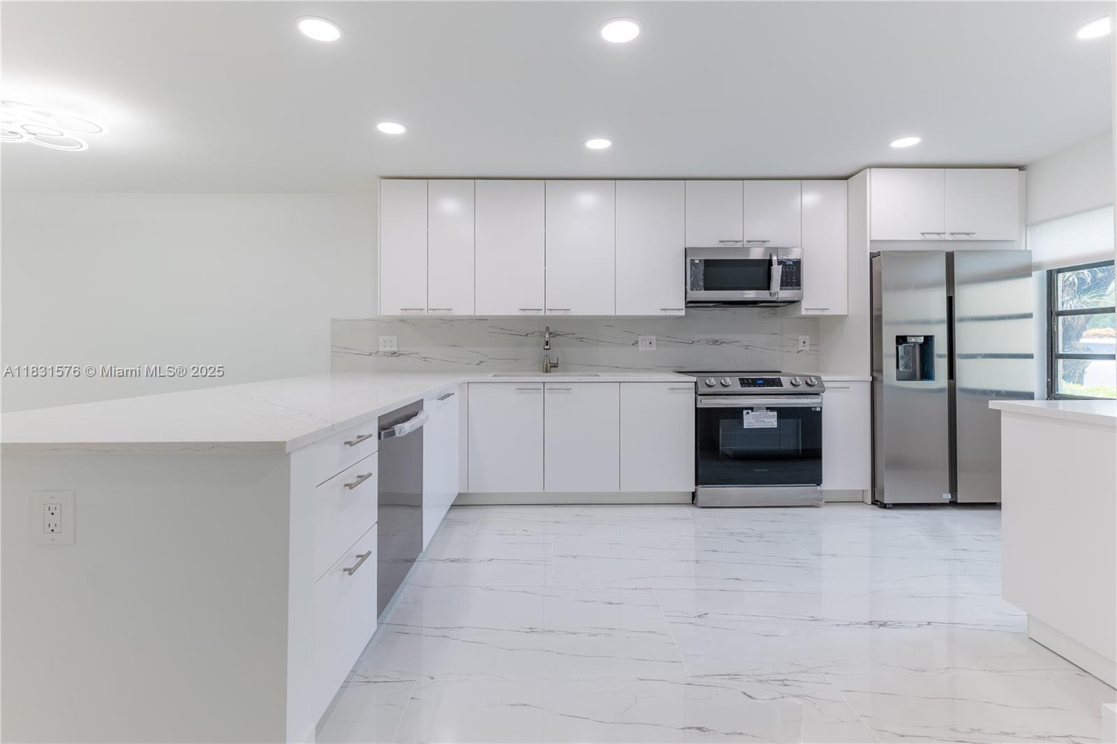 Welcome to your brand new 55+ home, a stunning 2/2 with a split bedroom plan designed with maximum privacy in a serene setting. This unit has been completely remodeled with no expense spared creating a truly luxurious living space, featuring high-quality Italian porcelain flooring throughout the unit, brand-new kitchen with granite counters and top-notch appliances including a wine cooler, advanced smart home technology including Google Nest control for the AC, LED lighting throughout,brand new bathrooms and water boiler. Brand new roof 2024. Fairways at Boca Lago has 2 tropical pools, clubhouse and guard gated entry to enhance your south Florida living. Boca Lago Country Club is available to join but membership is not mandatory, .