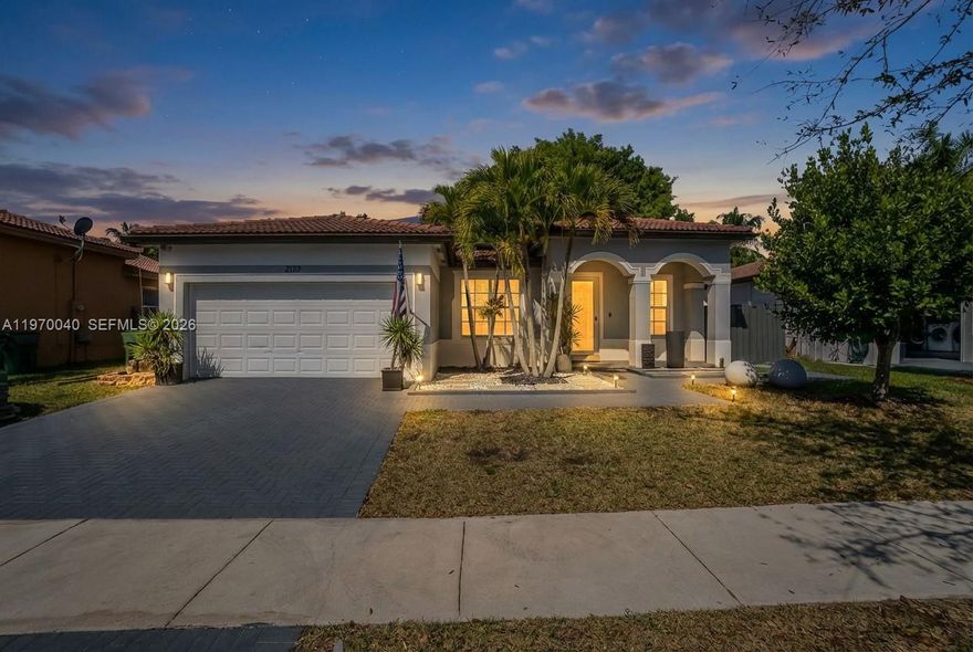 This fully renovated, one-story home features three bedrooms, two bathrooms, a two-car garage, and impact-resistant windows. There is also ample side space to park a 24–26 foot boat and an astonish pool with jacuzzi.
The interior boasts tile flooring, granite countertops, and stainless steel appliances. Recent upgrades include a new A/C unit and refrigerator (2025), a washer and dryer (2024), and updated electrical systems with dimmable lights (2024). All windows are equipped with Zebra blinds, with additional blackouts in the bedrooms.
The home is designed for entertaining, featuring:
- A Florida room and master bedroom each equipped with a fireplace.
- A Sony sound system in the Florida room.
- A terrace with roller shades overlooking a the pool and jacuzzi.
- Security system with eight cameras and a DVR recorder.
- Outdoor sensor lighting.
The property also includes leased solar panels with a fixed payment of $221 for 25 years, allowing for predictable costs while powering the home and charging electric vehicles. This lease can be transferred to the new owner or removed prior to closing.
Furthermore, the owner has an assumable FHA loan with a 3.5% interest rate available for qualified buyers.
Please contact me to schedule a visit to this exceptional home at Floridian Bay Estates.