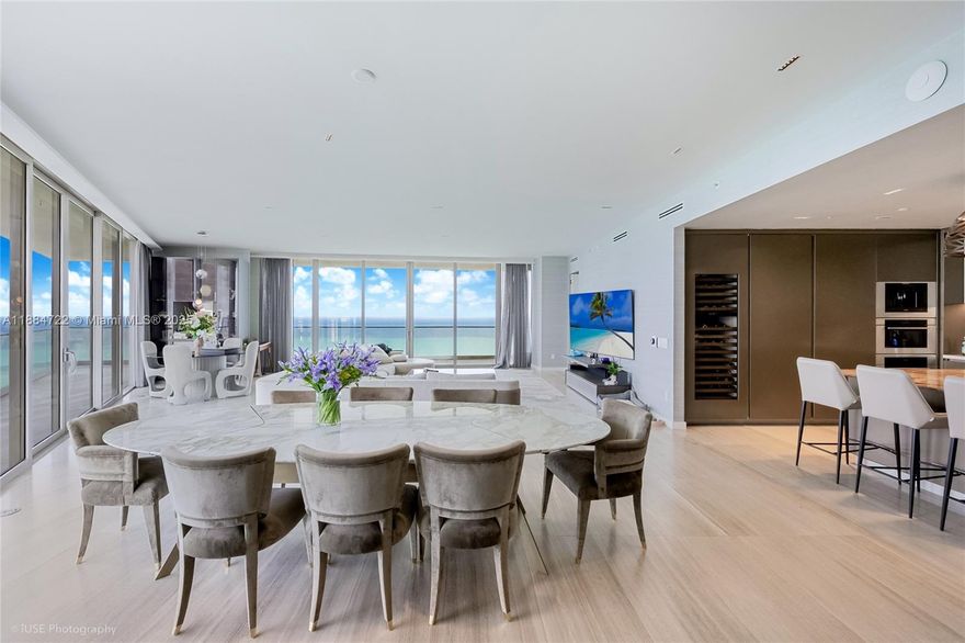 Discover a masterpiece at 18975 Collins Ave, Unit 2500—a corner residence with four bedrooms and five-and-a-half baths. Offering 3,748 sq. ft. of refined interiors plus 1,400 sq. ft. of terraces, this home spans 5,148 sq. ft. in total. Floor-to-ceiling glass frames sweeping Atlantic views, while interiors feature marble and premium tile finishes, an Italian-inspired kitchen with integrated luxury appliances, and a private two-car garage. Ownership includes the coveted Armani/Casa lifestyle: ocean-view fitness studio, Turkish Hammam spa, resort pool deck with attentive service, and private water access. Ideally positioned between Bal Harbour’s designer boutiques and Aventura’s dining scene, Unit 2500 defines Miami waterfront living.