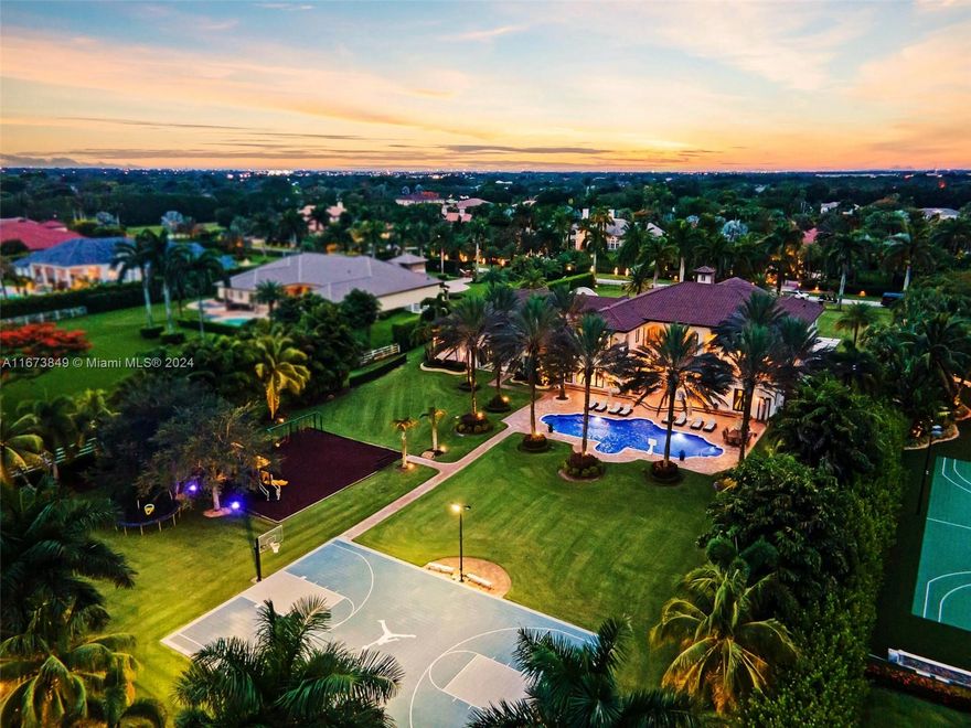 Villa Des Champs – Champions deserve a trophy asset and the premier lifestyle of Landmark Ranch Estates, the Hamptons of SoFL! Spend weekends indulging in the pleasures of a covered summer kitchen, refreshing pool, full-court basketball, playground & field. Step indoors & be enchanted by impeccable finishes like the backlit onyx bar in the living room & showcase wine cellar. A huge kitchen w/breakfast nook opens to family room & pool views. Expansive master suite w/sitting room, huge dual closets & private terrace. Intimate 14-seat theatre & office. Rejuvenate and relax in a world-class two-room Man Cave: lounge/conference room with wet bar & 2 huge TV’s; spa with cold plunge tub, walk-in hot tub, steam room & sauna. This truly unique estate exudes sophistication, elegance & functionality.