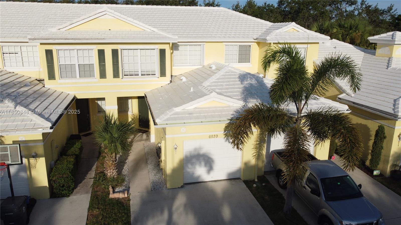 Beautiful 2-story townhouse in gated Lantern Key featuring 3 bedrooms, 2.5 baths, ceramic tile floors, and a 1-car garage with a 2-car driveway. Enjoy an open living area, new washer and dryer, and a 3-year-old cement tile roof. Spacious layout with all bedrooms upstairs. Community offers a pool, clubhouse, gym, playground, and walking paths. Convenient Lake Worth location close to shopping, dining, and major roads. Move-in ready and well maintained!