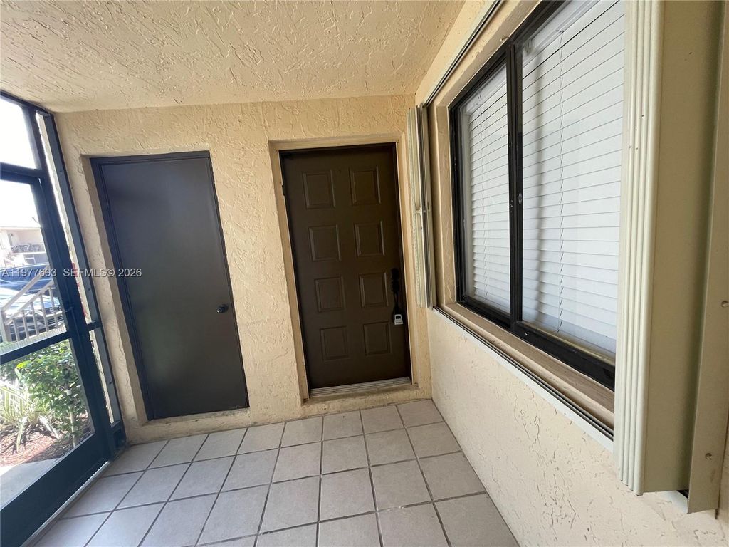 Photo of 16481 Blatt Blvd #102, Weston, FL 33326 (MLS # A11977693)