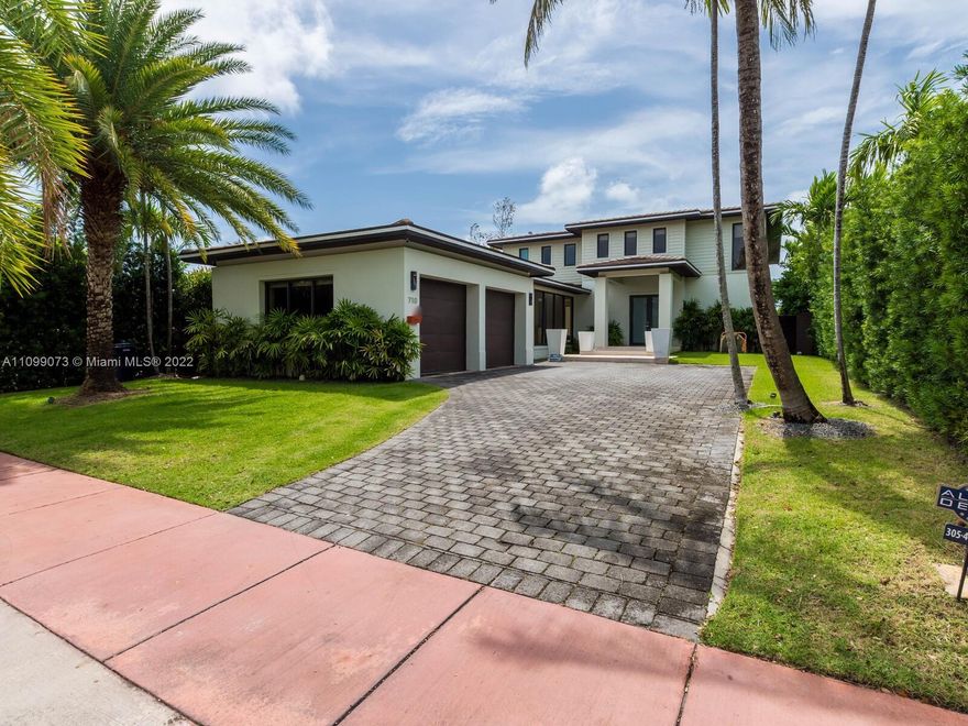 One of the finest homes built on Normandy Isles. 710 S Shore Drive sits in a quiet gated community with the  Normandy 18 hole golf club and a brand new tennis center.  The home is situated on 60 feet on the water.  A beautifully designed spacious 5 bedroom, 6 bathroom home with tasteful finishes, 2 car garage, wine cellar, expansive pool area and private dock with easy access to the ocean.  An amazing opportunity to to live on Normandy Isles.