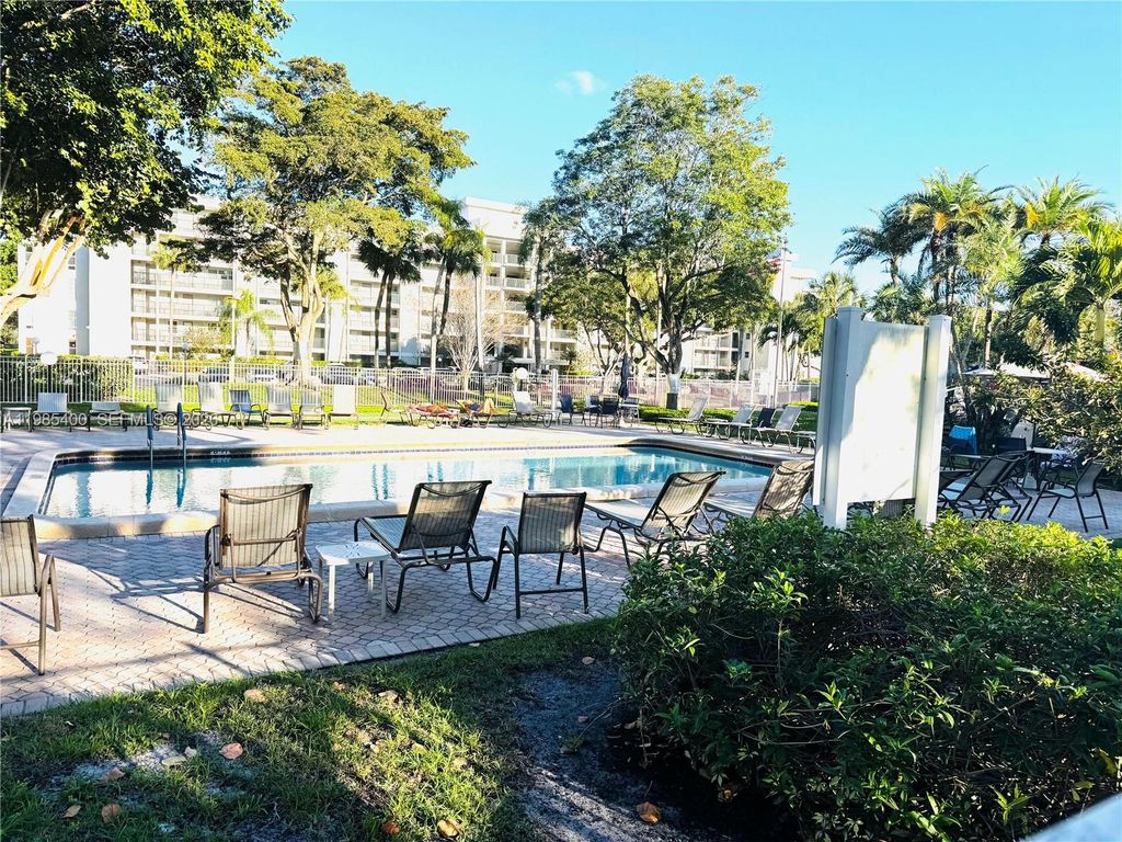 Photo of 2601 S Course Dr #409, Pompano Beach, FL 33069 (MLS # A11985400)