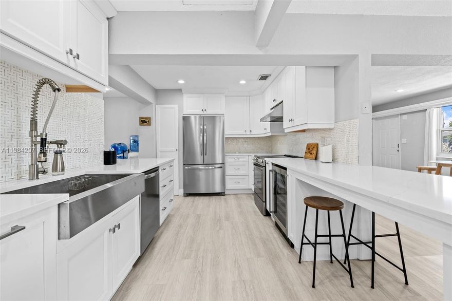 Showings start at OPEN HOUSE ON SATURDAY, MARCH 28, 2026 FROM 12 PM-5 PM! Step into this charming  2/2 + OFFICE single family home in East Pompano Beach. This home features impact windows and doors, 2025 roof, 2021 HVAC, 2022 washer & dryer, new front fence, new travertine pavers in front and patio, and fresh exterior pain 2026. Fall in love with this custom kitchen, updated floors, extra-wide driveway, and tons of backyard space. Flex room can easily be converted into a third bedroom. This home is located just off Federal highway close to shopping, beach, great parks, and amazing restaurants. NO HOA. Showings start 04/01/2026. Don't miss this amazing opportunity.