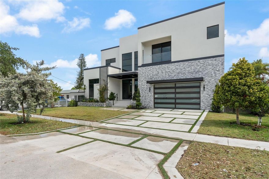 Ready Now to Move In! New Waterfront Modern Home. 7 bedroom, 8 Bathroom, 2 car garage (4 car garage option with lifts). 75' of waterfront with a 50' dock with direct access to Biscayne Bay including a 20,000-pound boat lift with space for all your water toys. Extra large backyard to enjoy heated pool/spa and tropical landscape. All windows and doors are hurricane-impact glass to provide storm protection. Interior finishes include Italian porcelain tile, Sub-Zero/ Wolf Appliances, and modern sleek kitchen design and finishes. All lighting is energy-efficient LED recessed and surface lighting. Ceilings are 12' on the 1st floor and 11' on the 2nd floor with 8' tall interior doors to give all rooms an expansive spacious feeling. This is the Miami waterfront lifestyle you are looking for!