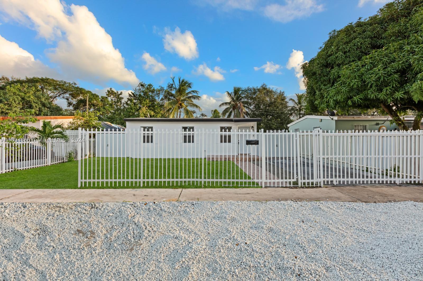 Welcome to this beautiful remodeled home with the largest square footage in the neighborhood. Fully fenced driveway and backyard, with enough space for a pool. New electrical, plumbing, 2024 air conditioning unit with warranty and brand new windows. Bathrooms redone as well as kitchen cabinetry with appliances included. Everything done with permits! Large bedroom and bathroom in the back as well as florida room with washer and dryer hookups. SELLER-PAID CLOSING COSTS IF USING CAPITAL TITLE PARTNERS AS TITLE COMPANY. Come see this unique opportunity in a desired neighborhood in Opa-Locka. See broker remarks for showings.