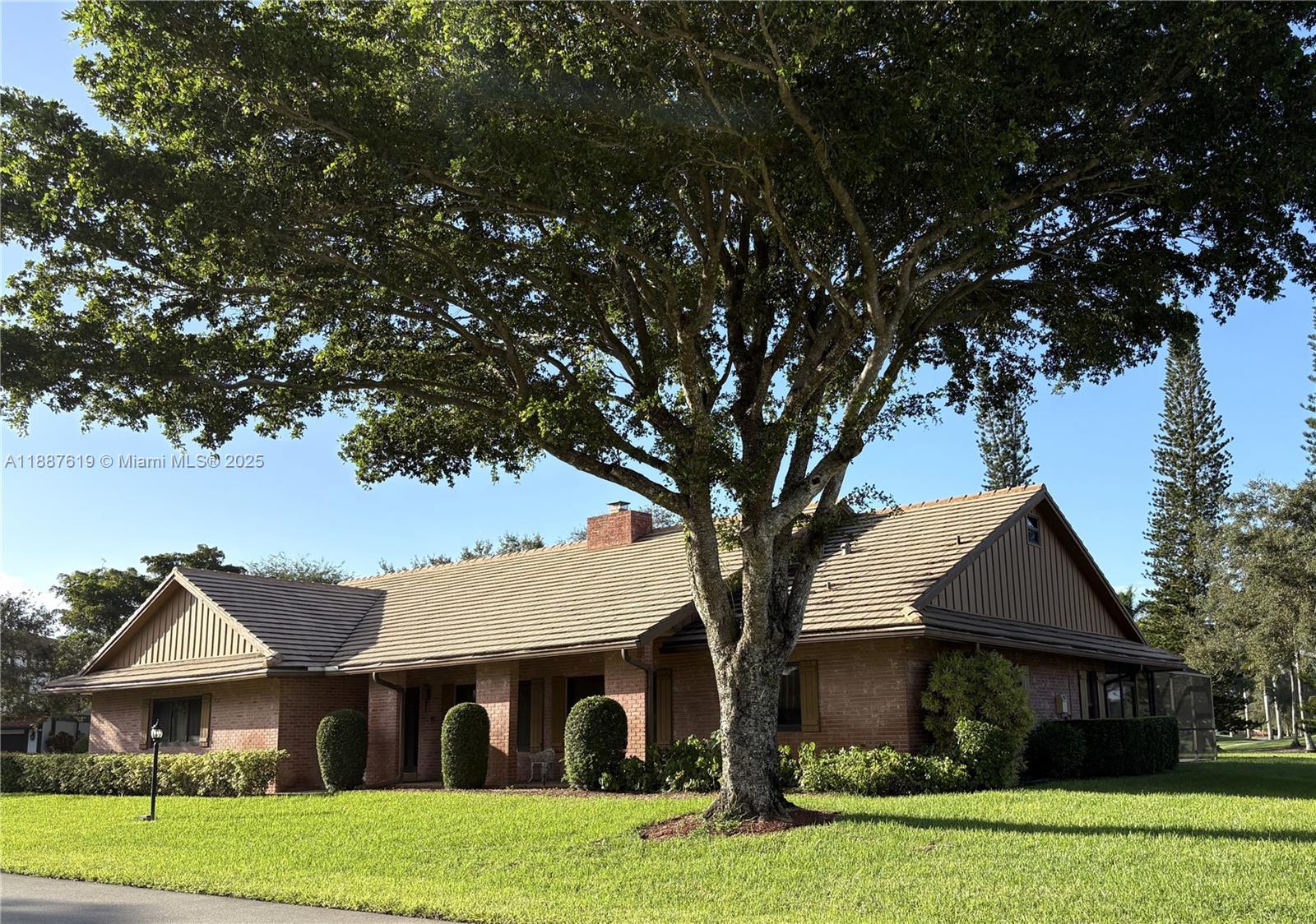 Experience luxury living in prestigious Lago Mar Colony! This gated golf course community features 98 custom homes and 27 condos with 24/7 manned security. This spacious 3 bed/3.5 bath pool home located on a quiet cul-de-sac offers a split floor plan, impact windows/doors, large laundry / mud room, and a wood-burning fireplace. The oversized garage with 11' ceilings and tall garage door is ideal for large vehicles, recreational toys or boat storage. Additionally, the large attic space offers potential for a loft, playroom or extra storage. Enjoy a private patio with serene pool and golf course views. Optional memberships to Lago Mar Country Club include golf, tennis, pickleball, dining, and events. Prime location near all major highways, FLL Airport, Sawgrass Mills & American Heritage.