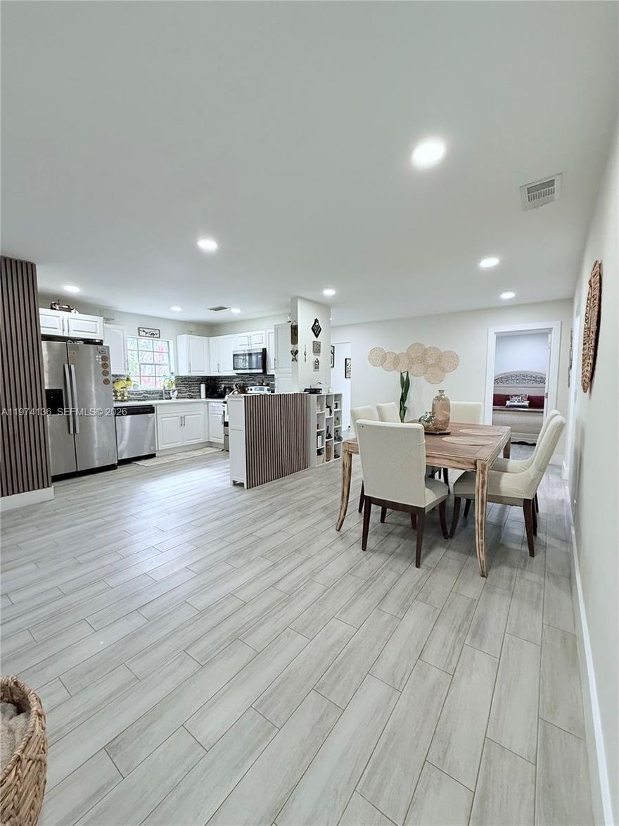 Step inside and feel the difference. A bright, open layout welcomes you with natural light pouring through every angle, creating a seamless flow between living, dining, and kitchen spaces. The entire home has been thoughtfully renovated with clean lines and timeless finishes designed to last. The kitchen features sleek quartz countertops, a designer tile backsplash, and a neutral palette that feels both modern and warm. Throughout the property, you’ll find neutral tile flooring, offering durability, elegance, and continuity from room to room. A newer roof adds peace of mind and long-term value.
Step outside and enjoy true Florida living on the screened-in patio, perfect for morning coffee, sunset dinners, or quiet evenings surrounded by lush, tropical landscaping. It’s private. It’s serene. It’s low-maintenance beauty. Corner unit. Conveniently situated near premier shopping, dining, entertainment, major highways, and airports, you’re connected to everything while still enjoying the comfort of home.
Bright. Open. Renovated. Turn-key. This is not just beautiful — it’s effortless living at its best.