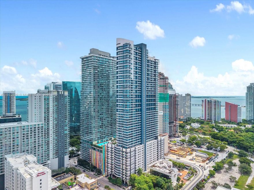 Discover an exceptional opportunity to own a premier office condominium in Infinity at Brickell, one of Miami’s most sought-after mixed-use luxury towers. Perfectly positioned in the heart of the Brickell Financial District, this 1,433 RSF space combines sophistication, functionality, and prestige—ideal for high-profile professionals and boutique firms alike. Featuring floor-to-ceiling glass windows, leading to a balcony, the office offers abundant natural light and expansive city views that create an inspiring work environment. The contemporary design, high-end finishes, and efficient layout allow for both private offices and open workspaces tailored to your business needs. The building is located within walking distance of Brickell City Centre, world-class restaurants, and luxury hotels.