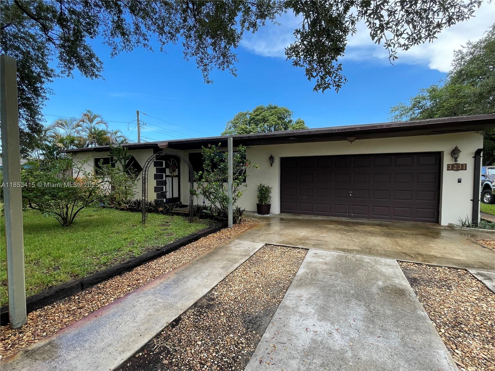 Beautiful single-family home in Hollywood featuring 3 bedrooms and 2 bathrooms on a rare double lot totaling 12,842 sq ft with 1,392 sq ft of living space. This home offers a large living room, open-concept kitchen, and a desirable split floor plan. Rest assured in a sound concrete block structure, 10-year-old roof and a brand new Rheem central A/C system. Enjoy the backyard featuring a mature mango tree that bares delicious fruit, and a detached storage unit. Plenty of outdoor space for entertaining or expansion. A perfect blend of comfort, space, and convenience in a prime location! Schedule your showing today! This won't be on the market for long....