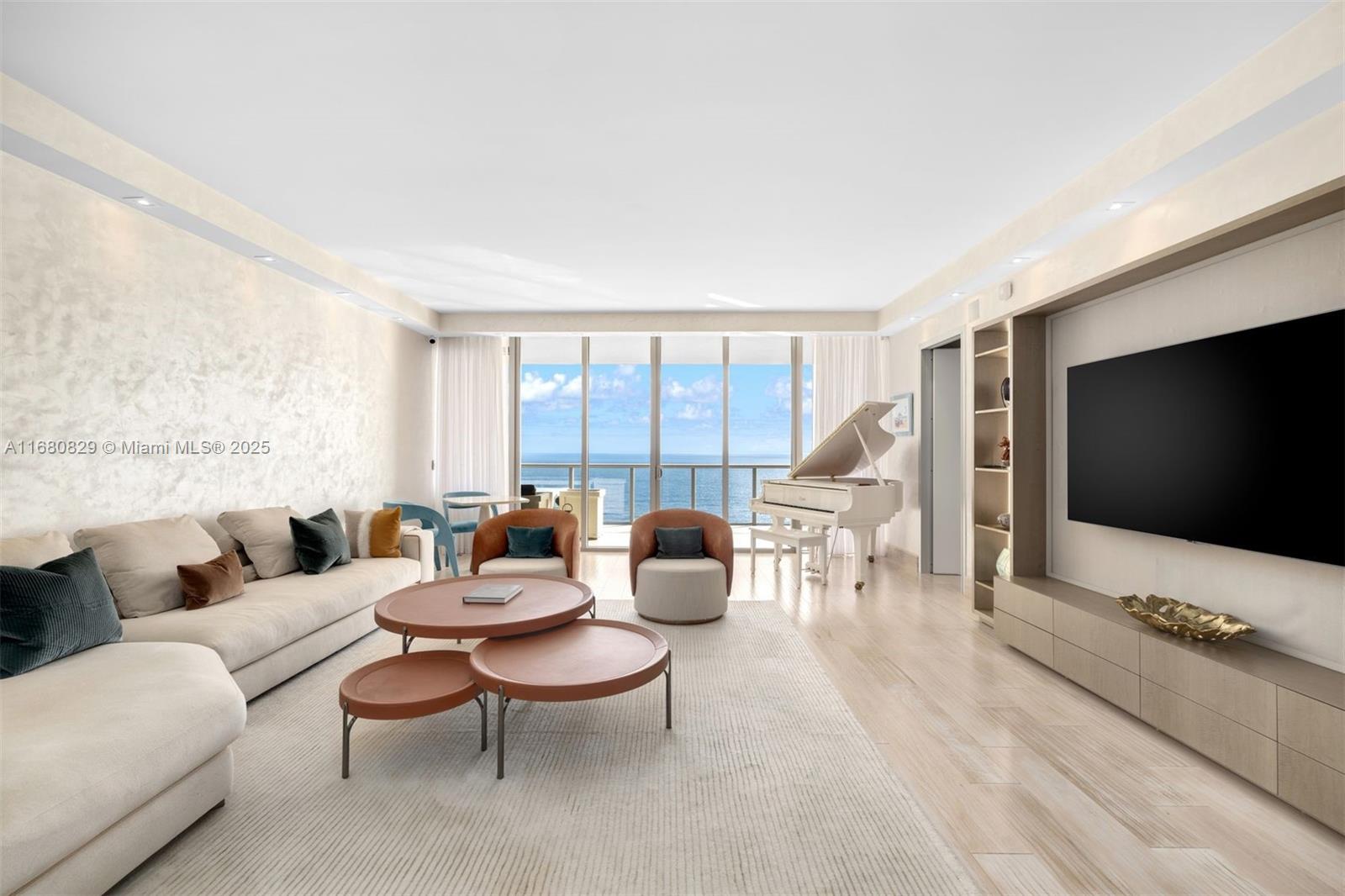 Experience luxury oceanfront living at St. Regis Bal Harbour. This 3BD/4BA flow-through residence spans 3,128 SF and offers stunning sunrise-to-sunset views. Enter through a private elevator foyer into an elegant living area with a chic bar, seamlessly connected to a dining space with bay and city views. Interiors showcase Fendi furniture and Adriana Hoyos-inspired finishes. The gourmet kitchen includes Miele/SubZero appliances and a white birch finish on cabinetry, with internal lighting throughout. An oceanfront living room provides privacy with Onyx sliding doors, while the primary suite features ocean views & a spa-like bathroom. Located across from Bal Harbour Shops, the building offers two pools, white-glove service, access to hotel amenities, and the ultimate beachfront lifestyle.