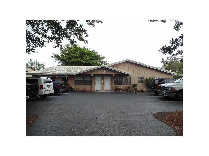 Peaceful lakefront 2 bedroom 2 bath unit in quad-plex **UNIT 11405** located in Coral Springs. Walk around to the unit's front door and through the wood fenced yard with counter and bench. Bright living room with a big window & dining space lead into kitc hen area. Newer stainless steel refrigerator. Tile floors throughout. Crown molding in dining area. Ceiling fans.