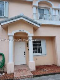 Photo 1 of 38 of 12078 SW 140th Ter 3-21 townhome