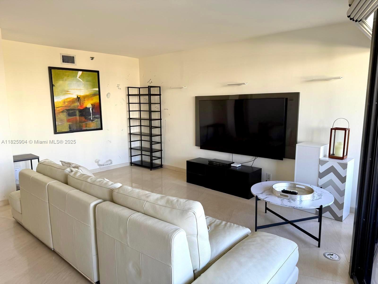 ONE OF A KIND CONTEMPORARY UNIT COMPLETELY RECONFIGURED AND RENOVATED BY TOP DESIGNER. 1 BEDROOM WITH CLOSED DEN AS 2ND BEDROOM, 2 FULL BATHS, FEATURING LIMESTONE MARBLE FLOORS THROUGHOUT, PORCELANOSA BATHROOMS, ARMADI CLOSETS, EUROPEAN OPEN KITCHEN, GRANITE COUNTERTOPS, MIELLE APPLIANCES, ITALIAN LIGHTING THROUGHOUT. A TRUE GEM! WASHER/DRYER. COMPLIMENTARY VALET AND SELF PARKING, CABLE TV, INTERNET IS INCLUDED IN THE RENT. BUILDING HAS REMODELED COMMON AREAS: LIBRARY, GYM, PARTY ROOM. LIVE IN PRESTIGIOUS WILLIAMS ISLAND WITH FULL AMENITIES ON SITE: 15 TENNIS COURTS, 4 PICKLEBALL COURTS, 4 RESTAURANTS, NEWLY RENOVATED ISLAND CLUB POOL, STARBUCKS, STATE OF THE ART SPA, MARINA WALK/JOG PATH, KIDS PLAYGROUND, COURTESY BUS AND CLOSE TO SHOPS, RESTAURANTS AND AVENTURA MALL.