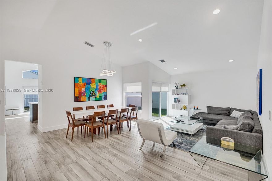 Welcome to 4928 SW 33rd Way, a beautifully maintained one-story home in the gated community of Banyan Oakridge in Hollywood. This 4-bedroom, 2.5-bath residence offers 1,852 sq ft of thoughtfully designed living space with a bright, open layout that feels both warm and inviting. The home showcases elegant tile flooring throughout and a seamless flow between the living, dining, and family areas—ideal for everyday comfort and entertaining. Large windows bring in natural light, enhancing the airy feel of the interiors. The spacious primary suite is conveniently located on the ground level and features dual sinks, a separate tub and shower, and generous walk-in closets. The kitchen is well-equipped with essential appliances and ample storage, connecting effortlessly to the main living areas. Additional highlights include a welcoming foyer entry, built-ins, pantry, and a 2-car attached garage with automatic opener. Set on a 5,109 sq ft lot with peaceful garden views, the backyard offers privacy, fencing. Residents enjoy access to a clubhouse, basketball court, tennis court, playground and security within this well-kept neighborhood.