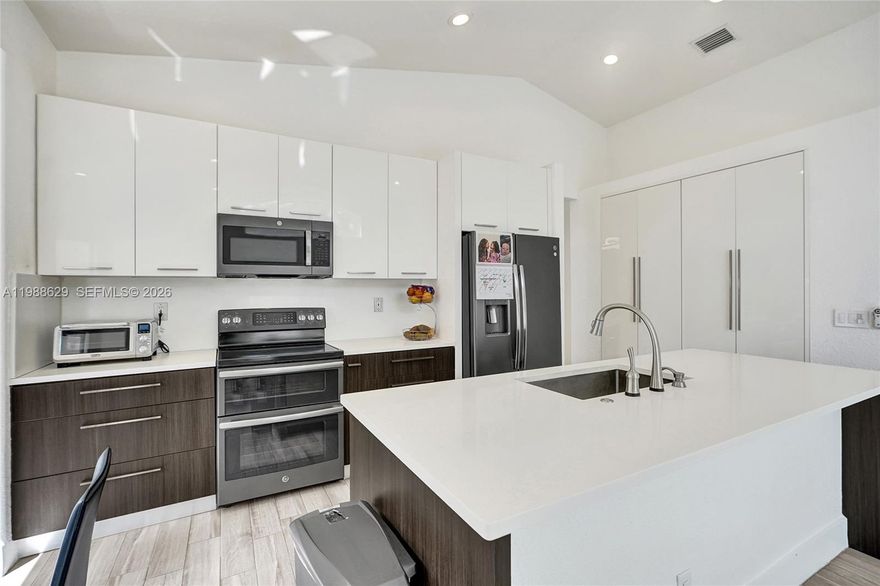 Welcome to 4928 SW 33rd Way, a beautifully maintained one-story home in the gated community of Banyan Oakridge in Hollywood. This 3-bedroom+1 house keeping room, 2.5-bath residence offers 1,852 sq ft of thoughtfully designed living space with a bright, open layout that feels both warm and inviting. The home showcases elegant tile flooring throughout and a seamless flow between the living, dining, and family areas—ideal for everyday comfort and entertaining. Large windows bring in natural light, enhancing the airy feel of the interiors. The spacious primary suite is conveniently located on the ground level and features dual sinks, a separate tub and shower, and generous walk-in closets. The kitchen is well-equipped with essential appliances and ample storage, connecting effortlessly to the main living areas. Additional highlights include a welcoming foyer entry, built-ins, pantry, and a 2-car attached garage with automatic opener. Set on a 5,109 sq ft lot with peaceful garden views, the backyard offers privacy, fencing. Residents enjoy access to a clubhouse, basketball court, tennis court, playground and security within this well-kept neighborhood.