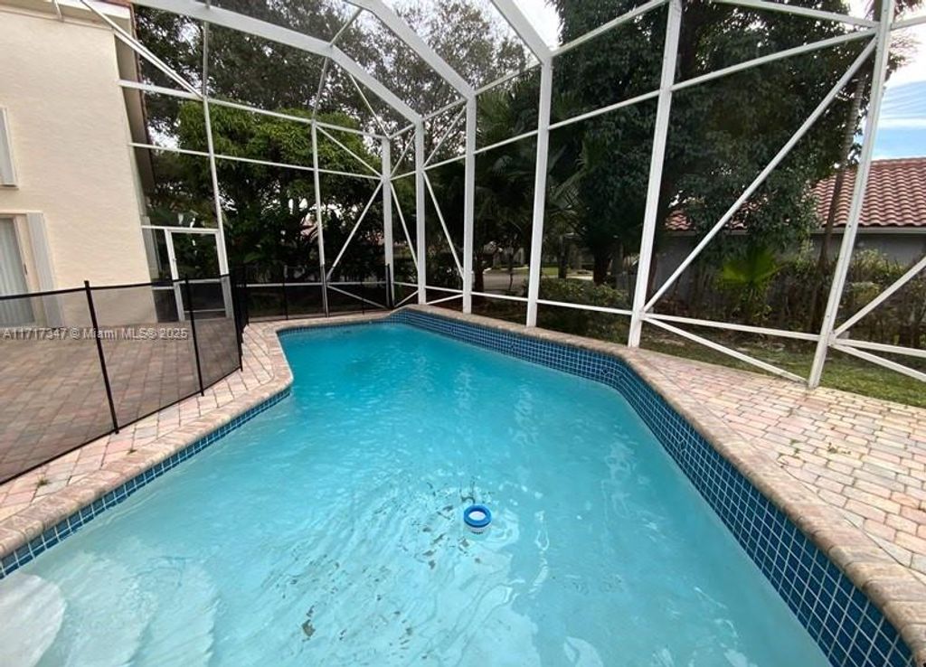 Photo of 6020 NW 61st Mnr, Parkland, FL 33067 (MLS # A11717347)