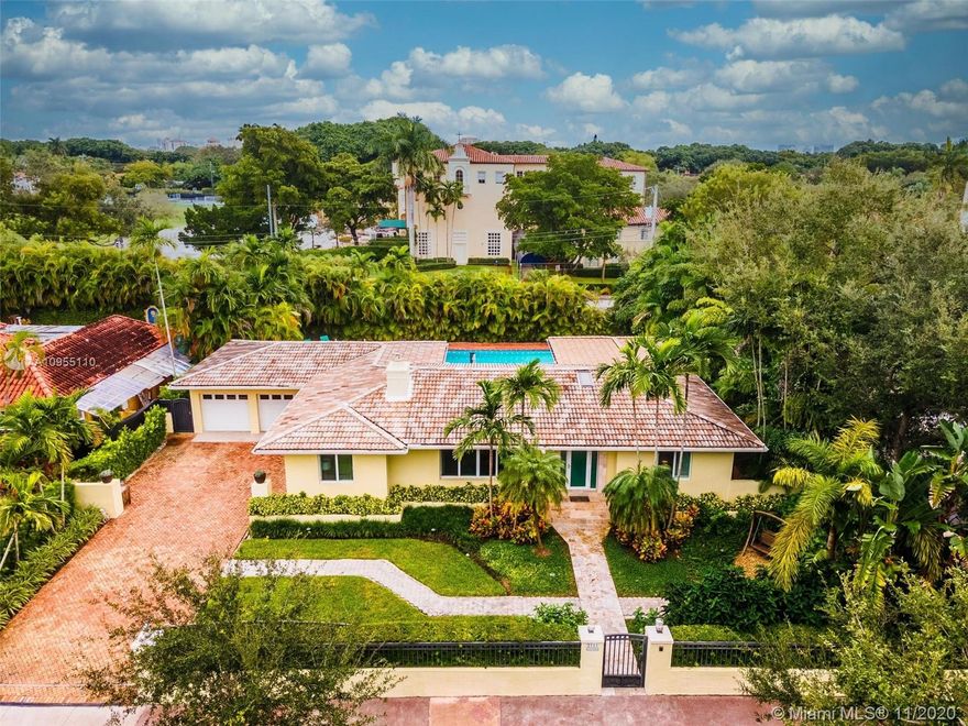 Look no further! Discover this exquisite mid-century home located in an oak canopied street in one of the most fabulous areas of the gables, within steps of the Biltmore Hotel and golf course. Entirely renovated, this 3 bedroom 3 1/2 bathroom home features a great floor plan with marble and wood floors throughout, impact windows and doors, sleek designer kitchen with a gorgeous view of the 20 X 40 foot heated pool and lush outdoor area. This home provides the perfect setting including 2 en-suite masters, one of them being around 600 sqft. Other features include a Kohler steam spa by the pool area, 2 car garage, gated walls and lots of natural light. Within a stroll to The Venetian Pool, Salvatore Park, Church of the Little Flower and more. Truly a gem! See 3D virtual tour.