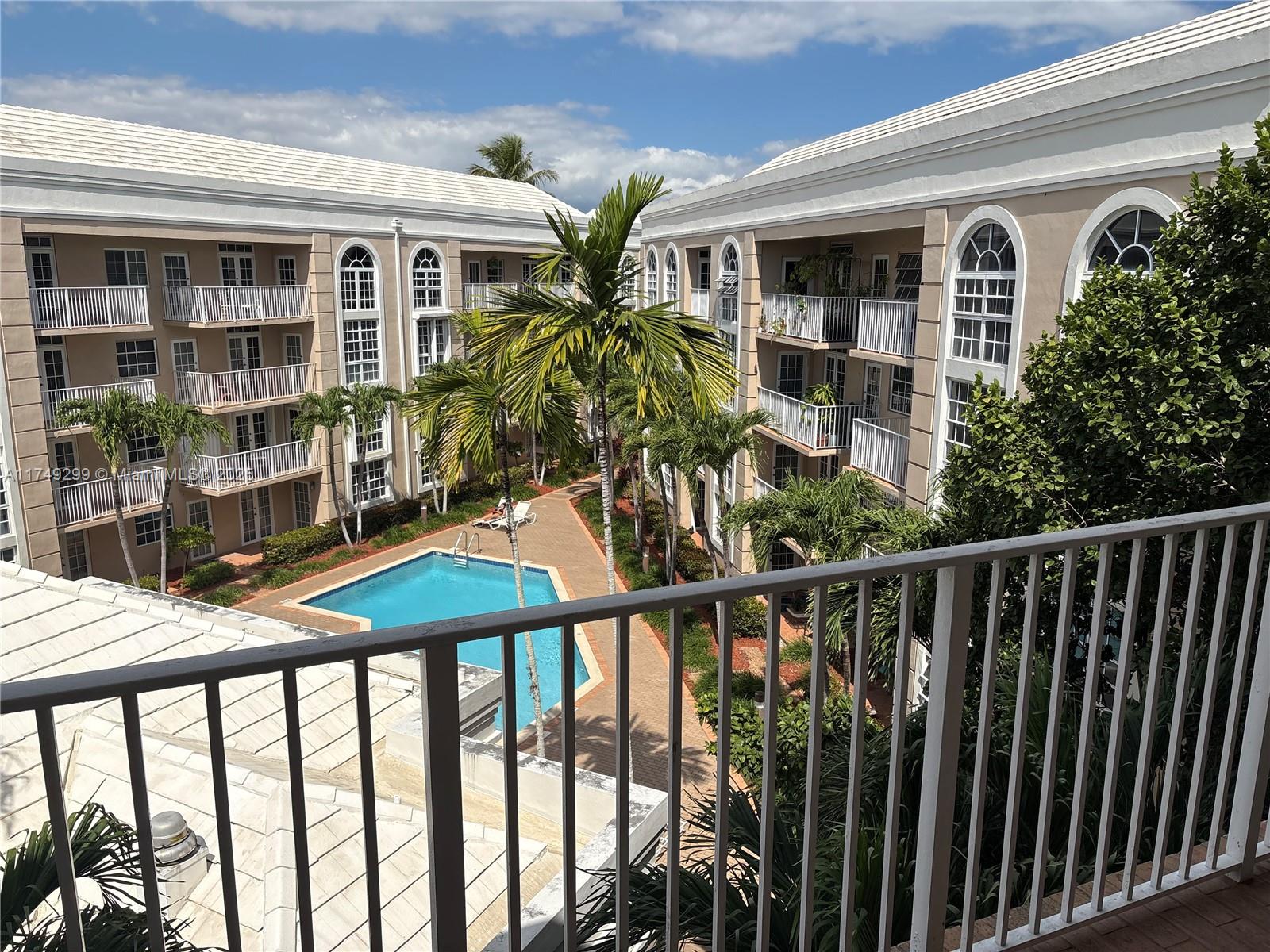 2 Bed 2 Bath "Penthouse" Investment Property at University Inn w/ balcony overlooking the pool and greenery. Prime location directly across from the UM which makes for a strong recurring renter pool. High ceilings, arched windows in living room, and large master bedroom, 1 parking space, and 1 storage unit. Recently Renovation in 2022 - full bathroom (tile, bath-tub, marble vanity, faucet, toilet), removed popcorn ceiling, fresh paint, new microwave/oven/HVAC unit, and tankless water heater, digital lock. Washer/Dryer in unit. Building amenities include a pool, jacuzzi, on-site management, secured entry, and nighttime roaming security guard. Walk to campus, Publix, Whole Foods, Sunset Place, the Metrorail, etc. Tenant Occupied until August 1st 2025, Tenant renting only 1 BR for $1700/mo