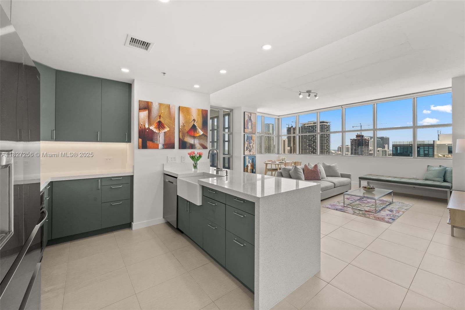Welcome to this completely renovated unit in 4 Midtown. Upon entry to this expansive 2 bed 2 bath coveted "12 line" corner unit you are immediately greeted with an abundance of natural light coming from its southern exposure. Enjoy sweeping water and city skyline views from every corner of the unit or while you prepare a meal in the custom chef's kitchen. The primary suite offers direct water views from the second you open your eyes in the morning and enjoy a spa-like bathroom, walk in closet and wrap around terrace. The building offers a state-of-the-art gym, pool with BBQ area, 24-hr security, and concierge. Unbeatable location—walk to top restaurants, fitness studios, coffee shops and the Design District. Minutes to Miami International Airport and the Beaches.