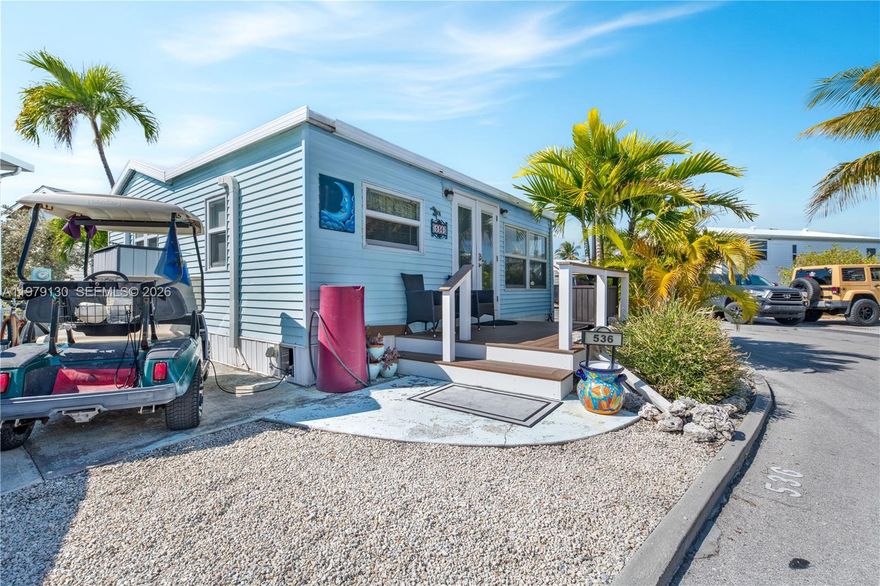 Welcome to your slice of the Florida Keys lifestyle! This charming beach-themed retreat is the perfect blend of cozy comfort and coastal style. This 2-bedroom, 1-bathroom turnkey home is move-in ready — whether you're looking for a full-time residence, vacation getaway, or income-producing rental. Step inside to a fresh, inviting living space designed for relaxed island living. The bright white kitchen pops with marble countertops and a stunning blue tile backsplash, bringing those breezy ocean vibes right into your home. It's light, cheerful, and perfect for entertaining friends and family after a day on the water. And here's the best part — even though this property sits on a dry lot, you still enjoy beautiful open water views. Venture Out is one of the most sought-after gated communities in the Lower Keys, known for its active lifestyle and incredible amenities: Heated community pool, Marina & boat ramp with direct ocean and Gulf access, Tennis & pickleball courts, Basketball courts, Private convenience store, Children's playground & pool, Recreation hall, 24-hour gated security. Bring your boat, your golf cart, and your flip-flops — this neighborhood was made for enjoying the water. Located just 20 miles from Key West, you're close enough for dining, nightlife, and the airport — but far enough away to enjoy peaceful island living. If you've been dreaming of a cozy, beach-inspired Keys escape with income potential and resort-style amenities... this is the one.