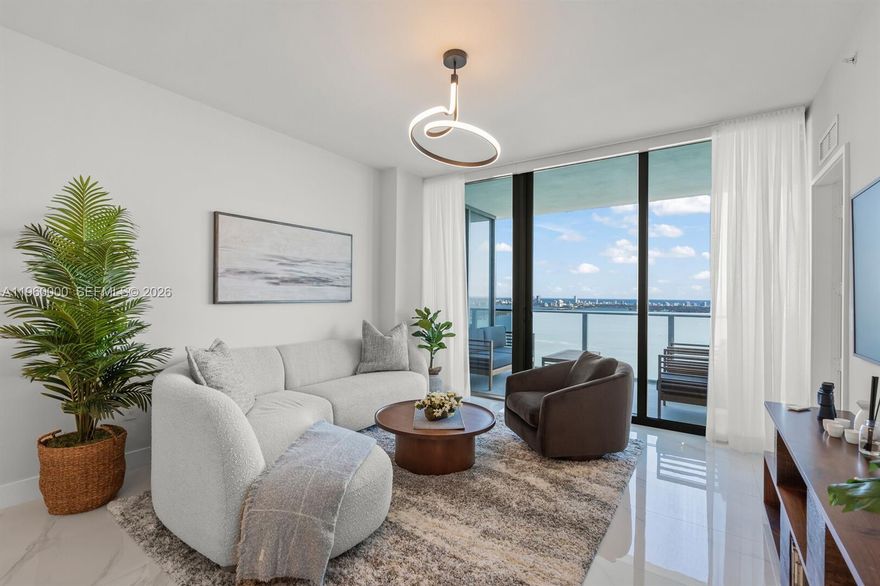 Luxury residence on the 39th floor of Aria Reserve with breathtaking panoramic views of Biscayne Bay and the Miami skyline. This never lived-in 1 Bedroom + Den, 2-bath residence features a modern design, spacious layout, and floor-to-ceiling windows that fill the space with natural light. Offered fully furnished and move-in ready, the unit includes electric curtains throughout, glass shower enclosures, LED-lit mirrors, and elegant finishes. The den provides flexibility for a home office or guest space.
Aria Reserve offers an exceptional resort-style lifestyle with a private sports marina, full-service spa, state-of-the-art fitness center, tennis, paddleball, squash and basketball courts, mini golf, dog park, and two pools with water views, including a semi-Olympic pool. Prime waterfront location with easy access to Miami Beach and Downtown.